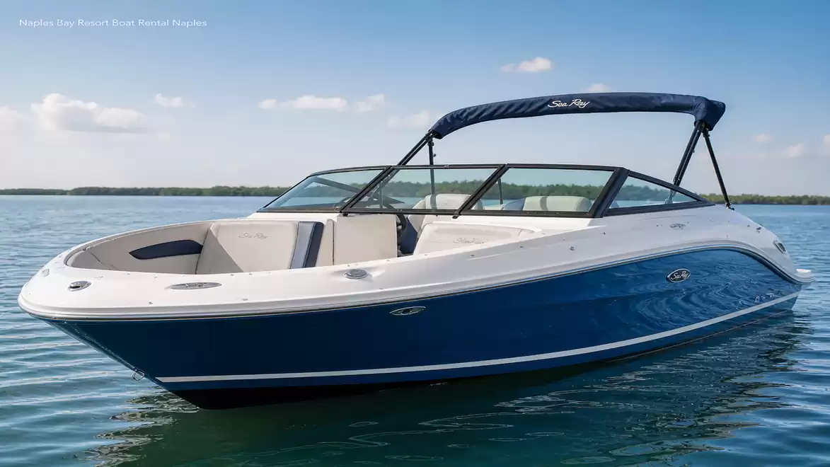 A sleek blue motorboat on a calm lake under a clear blue sky.
