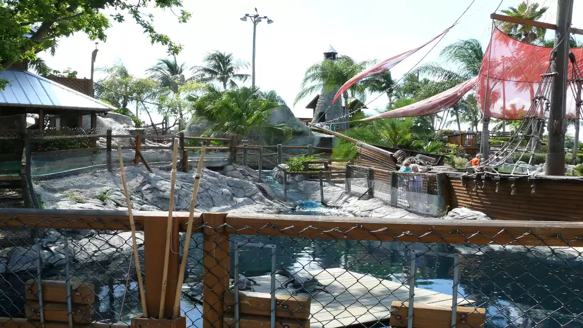Adventure pirate playground with boat and palm trees.