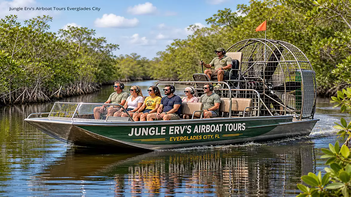 A group of people enjoying an airboat tour through the expansive, greenery-lined waters of the Everglades on a sunny day.