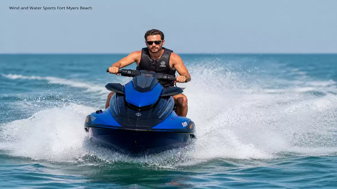A person riding a blue jet ski in sunny weather on the sea.