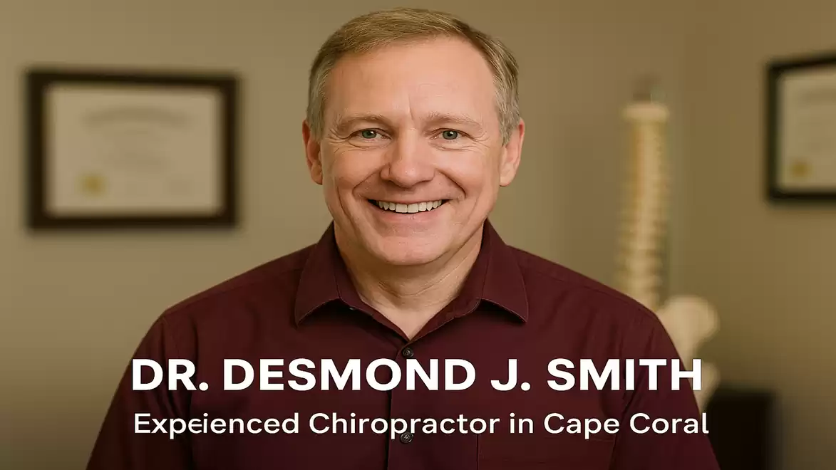 Portrait of a smiling man in a dark shirt, in front of a blurred background with certificates on the wall. Text on image: DR. DESMOND J. SMITH - Experienced Chiropractor in Cape Coral.
