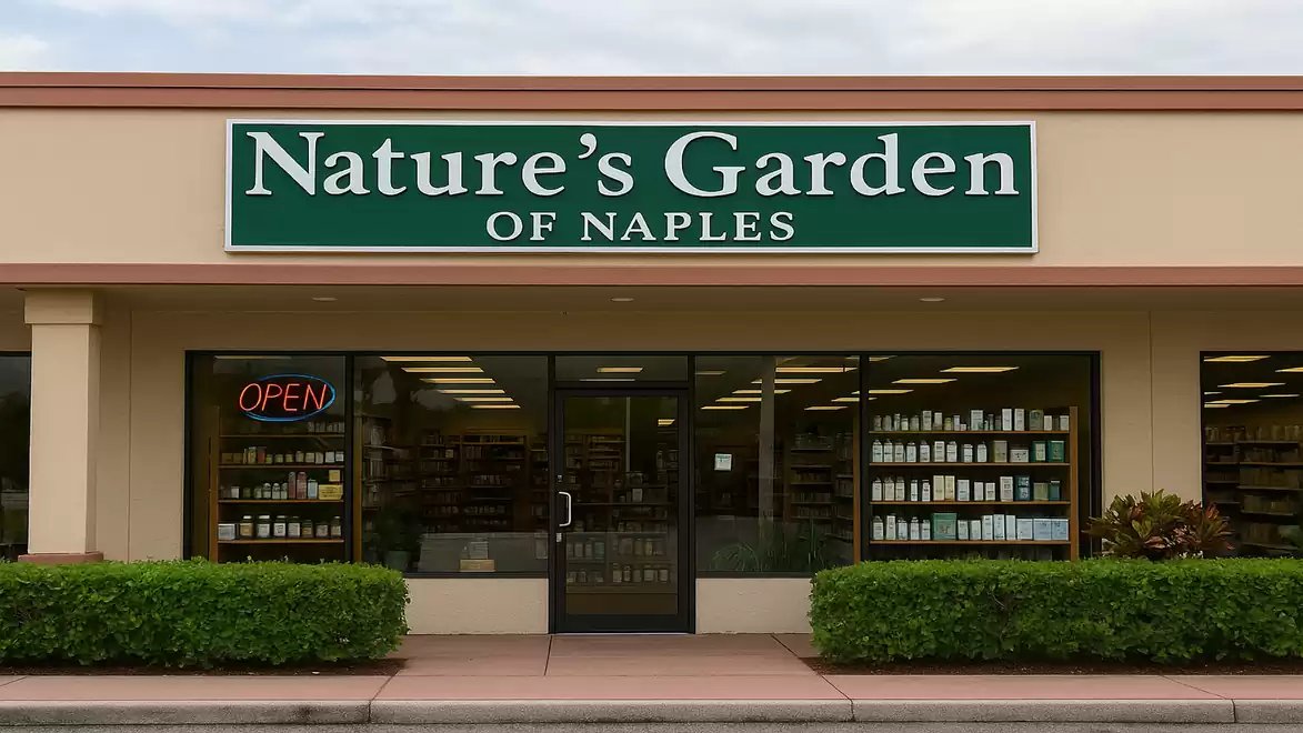 Front view of a store with a green sign 'Nature's Garden of Naples' above the entrance, which is open.