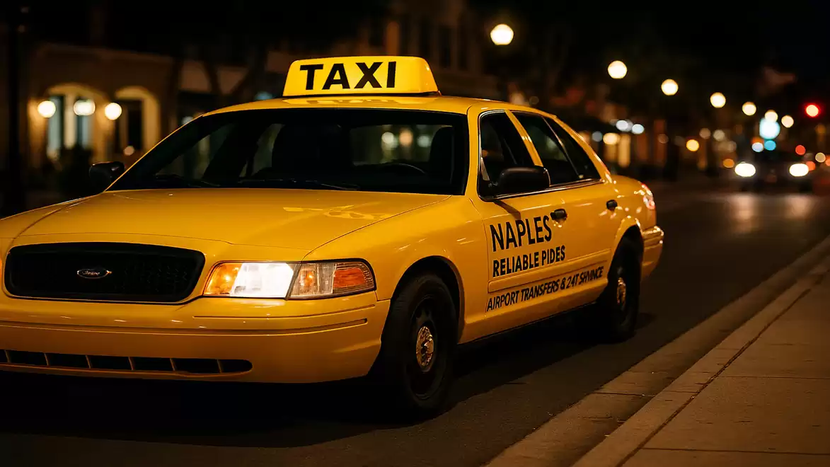 A yellow taxi with the sign 'NAPLES RELIABLE RIDES' parked on a well-lit street at night.
