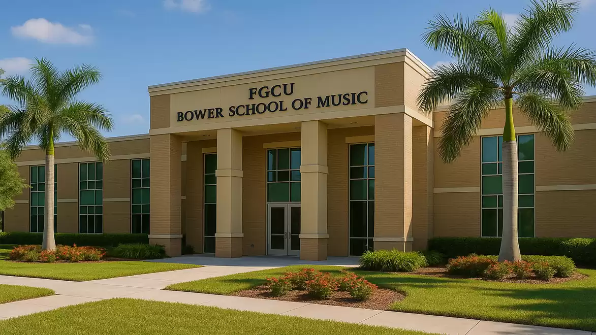 Entrance of FGCU Bower School of Music with palm trees and well-maintained lawn.
