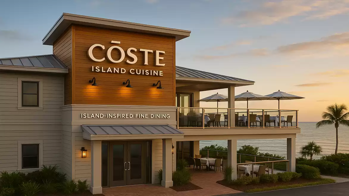 A stylish restaurant called Coste Island Cuisine with a balcony overlooking the sea at sunset.