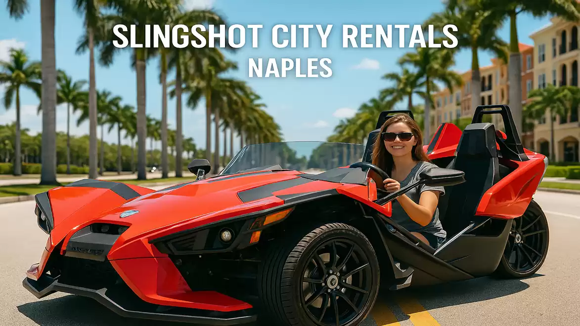 Woman in a red slingshot car on a road in Naples with palm trees and buildings in the background.
