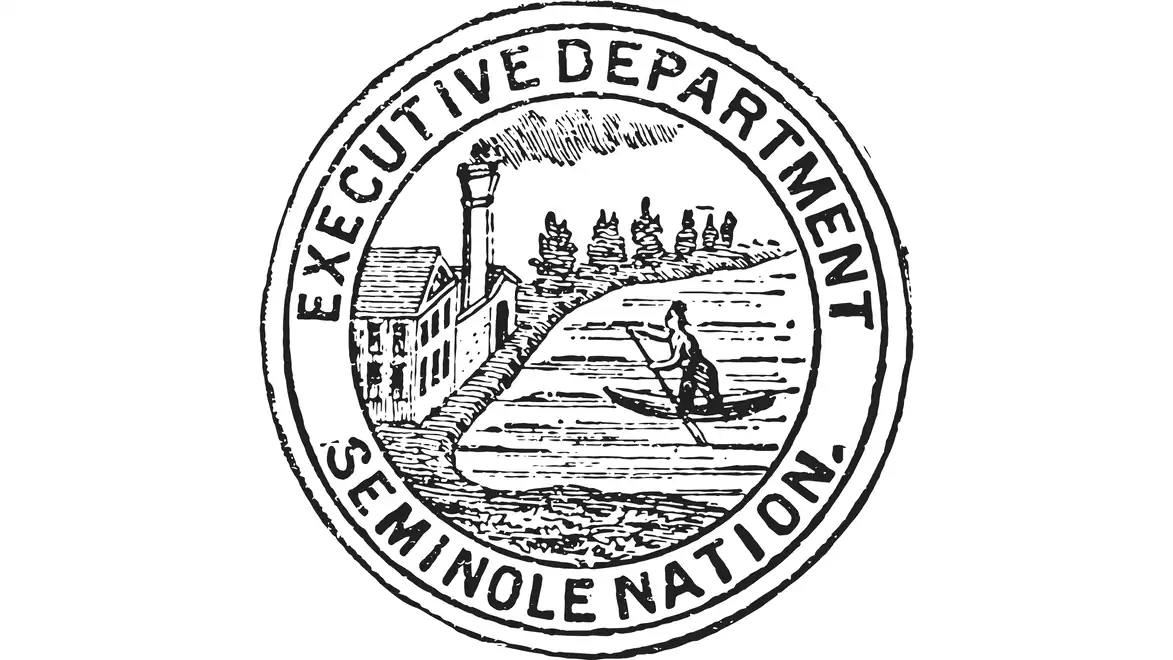 Seal of the Seminole Nation's Executive Department featuring a canoe and a village in the background.