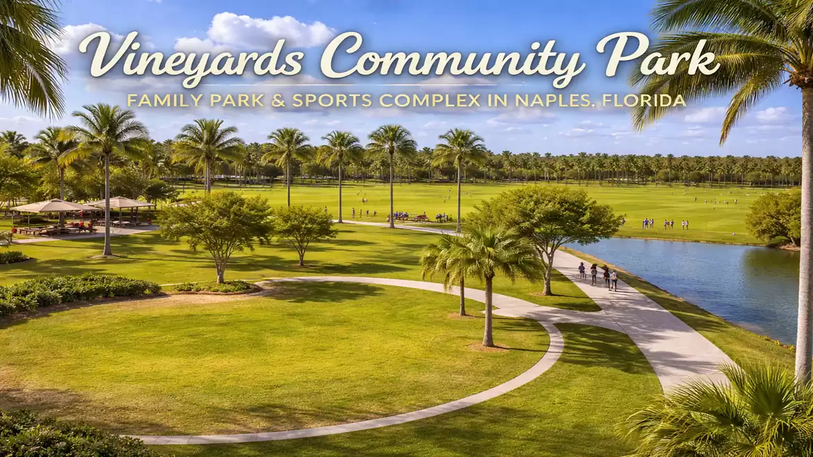 Green park with palm trees and walking path in Vineyards Community Park, Naples, Florida.