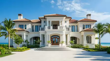 Luxury beachfront house with Mediterranean design, surrounded by palm trees under a blue sky.