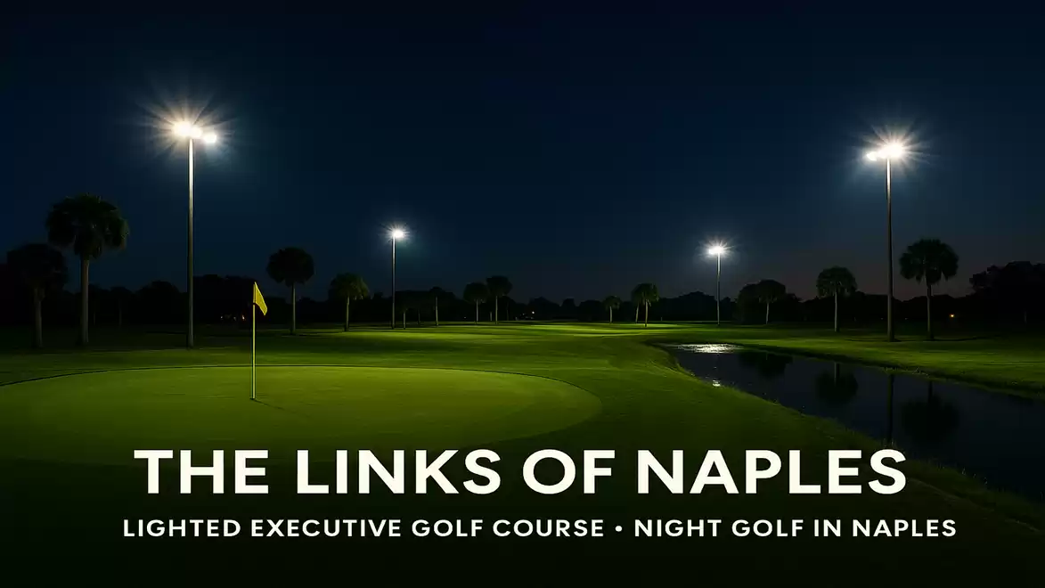Night view of a lit golf course with palm trees and a water feature, a golf flag in the foreground.