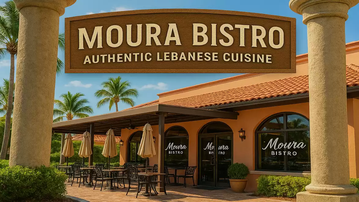 Exterior view of Moura Bistro, a restaurant offering authentic Lebanese cuisine, with outdoor seating under umbrellas and palm trees in the background.