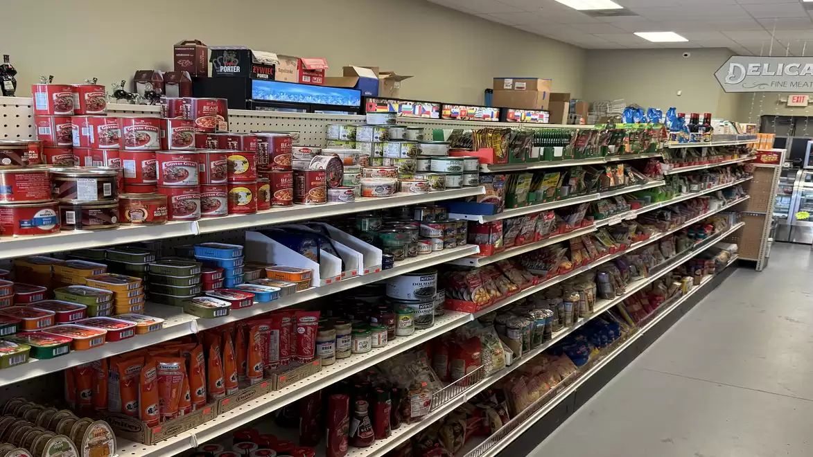 Shelves in a grocery store with various food items and products.