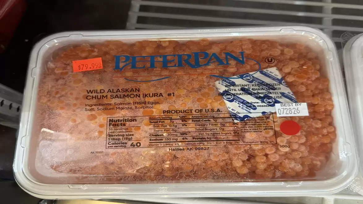 Container of Wild Alaskan Chum Salmon Roe by Peter Pan in a refrigerator.