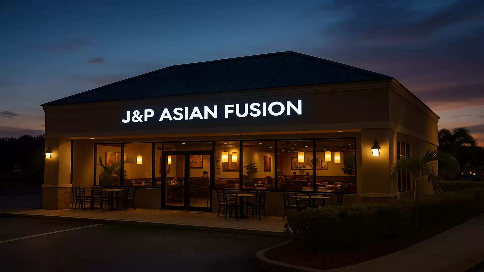Exterior view of a lit-up Asian Fusion restaurant at night.