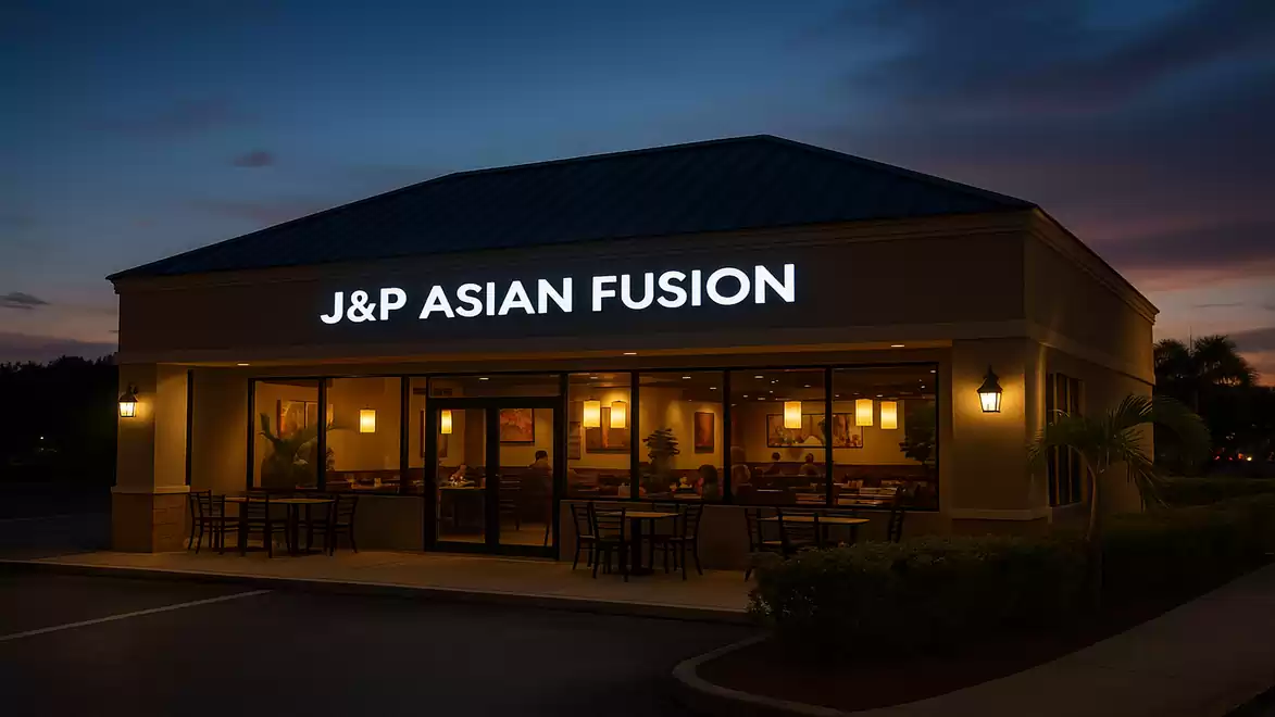 Exterior view of a lit-up Asian Fusion restaurant at night.