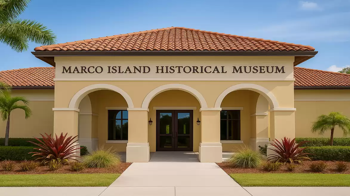 Front view of the Marco Island Historical Museum with Mediterranean architecture.
