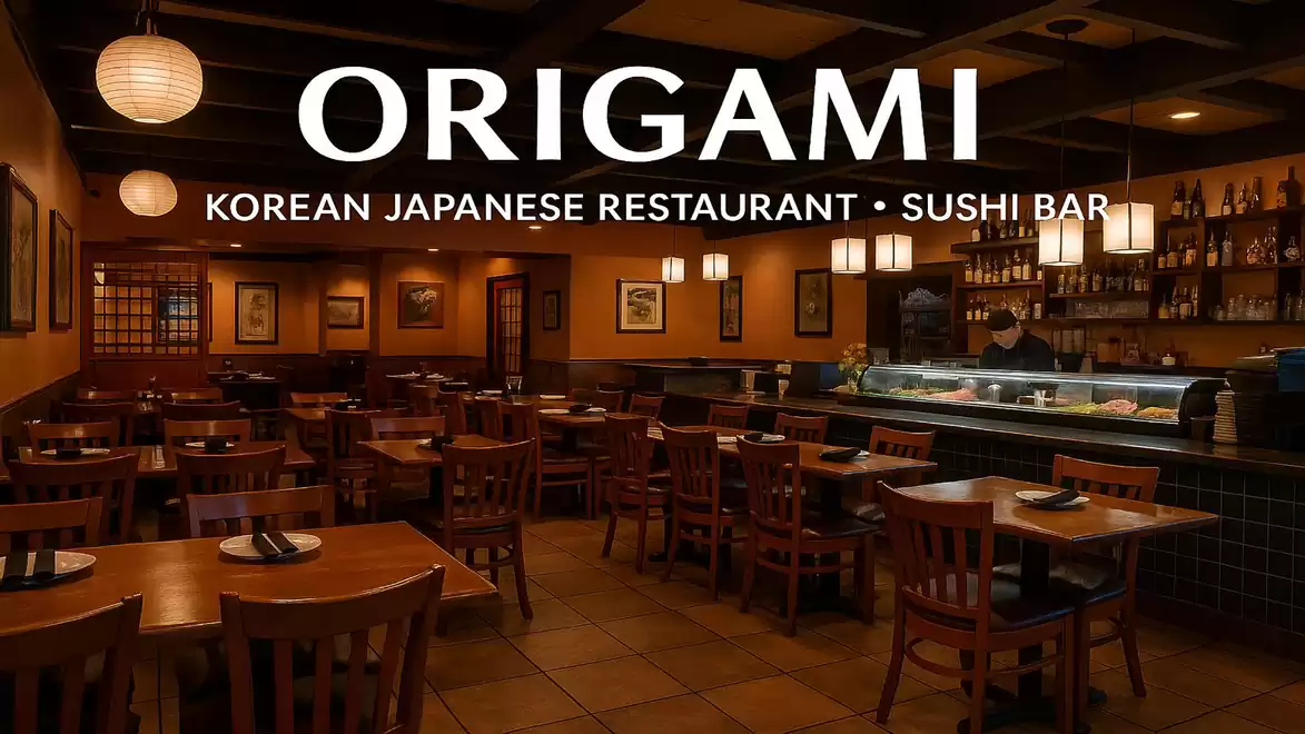 Interior view of a stylish Korean-Japanese restaurant called Origami with dark wood furnishings and a sushi bar.