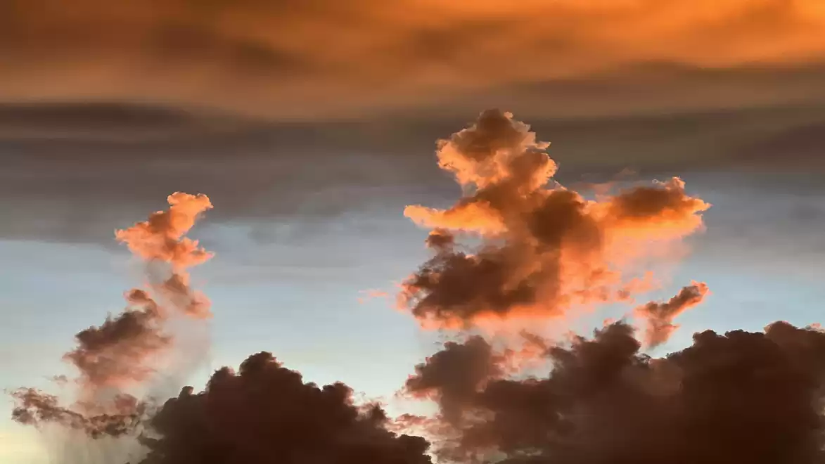 Dramatic sky landscape with orange clouds during sunset