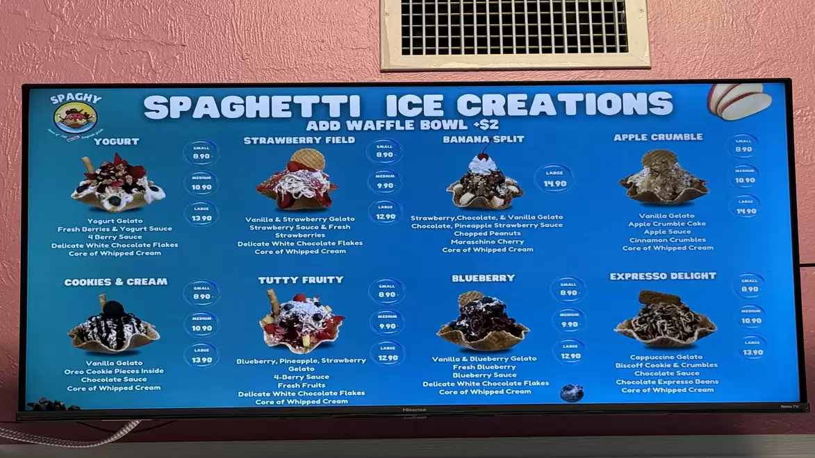 Digital menu board displaying various spaghetti ice cream creations in an ice cream shop, including flavors like yogurt, strawberry field, and banana split.