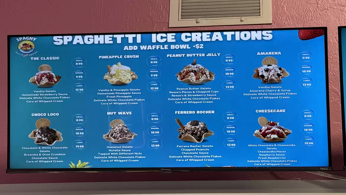 Display of spaghetti ice cream creations with different flavors and prices on a screen.