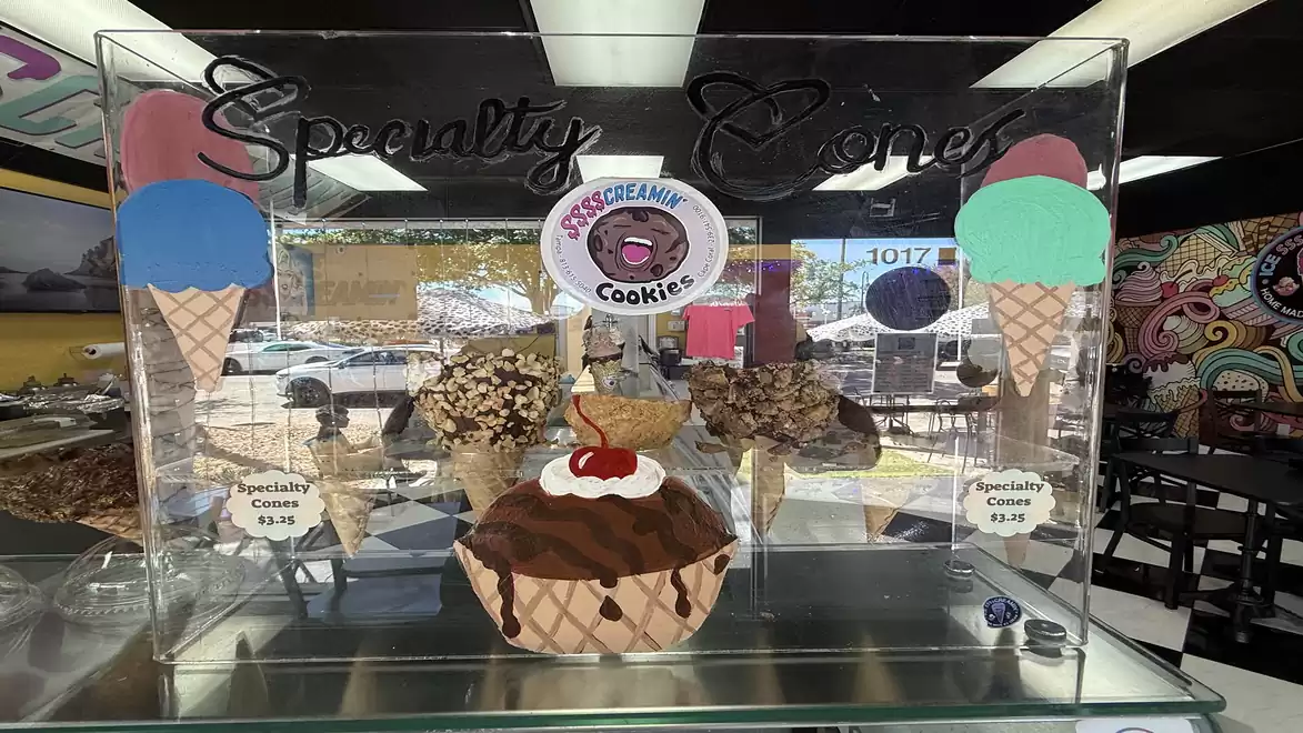 Ice cream shop display featuring special waffle ice cream creations. Various ice cream specialties displayed in decorative waffle cones.