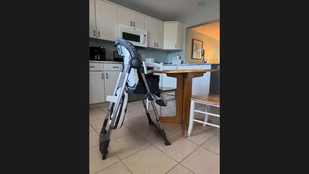 A kitchen table with a ladder and a bench in a modern kitchen.