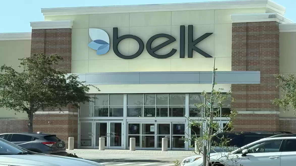 Front view of a large retail store with the logo and signage 'belk' on the building.