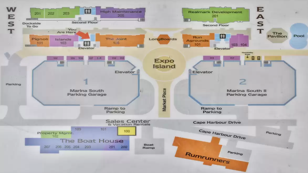 A map featuring various buildings, parking areas, and directions in a recreational or amusement facility. The map includes areas such as Expo Island, parking garages, and restaurants.