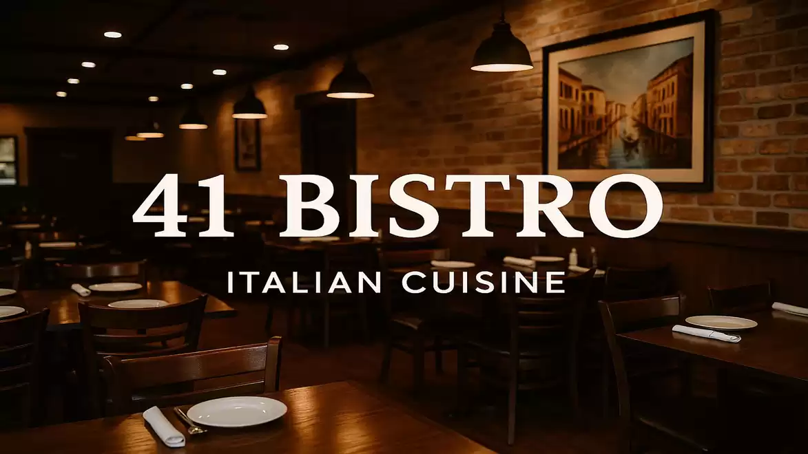 Interior view of a cozy Italian restaurant called 41 Bistro with ambient lighting and elegantly set tables.