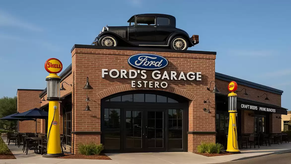The image shows the facade of a Ford's Garage restaurant in Estero with an antique car on the roof and Shell gas pumps on the sides.