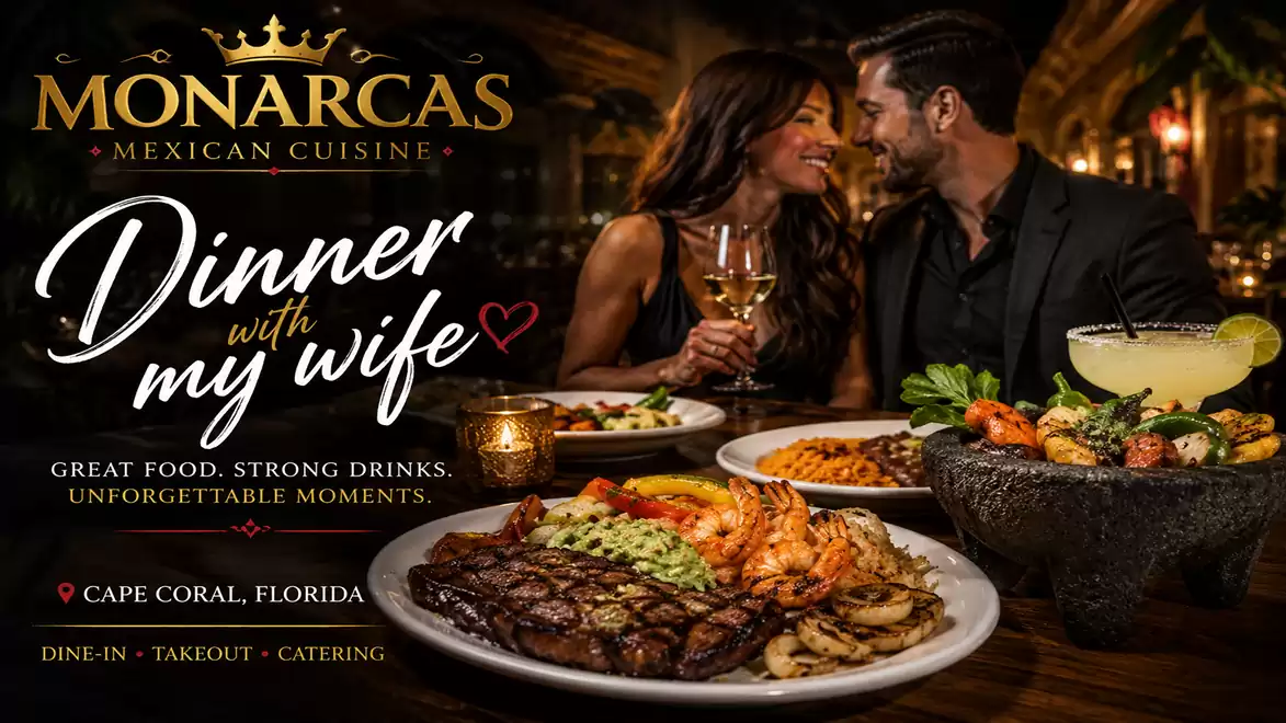 An elegant couple enjoys a romantic dinner at a Mexican restaurant with a richly set table.