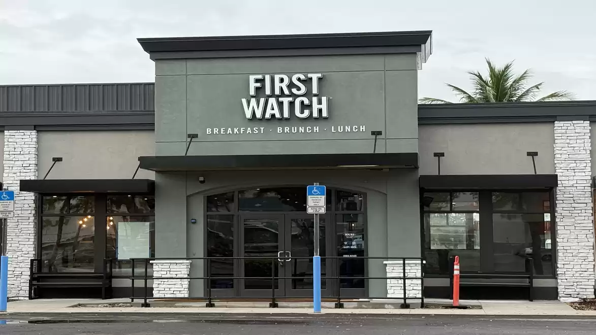 Front view of a modern restaurant named 'First Watch', specializing in breakfast, brunch, and lunch