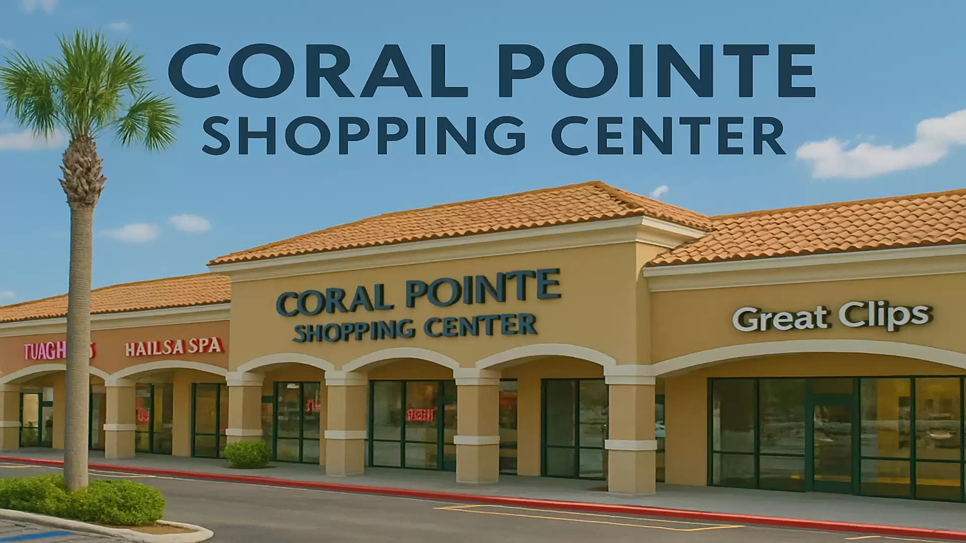 Coral Pointe Shopping Center with stores under blue sky and palm trees.
