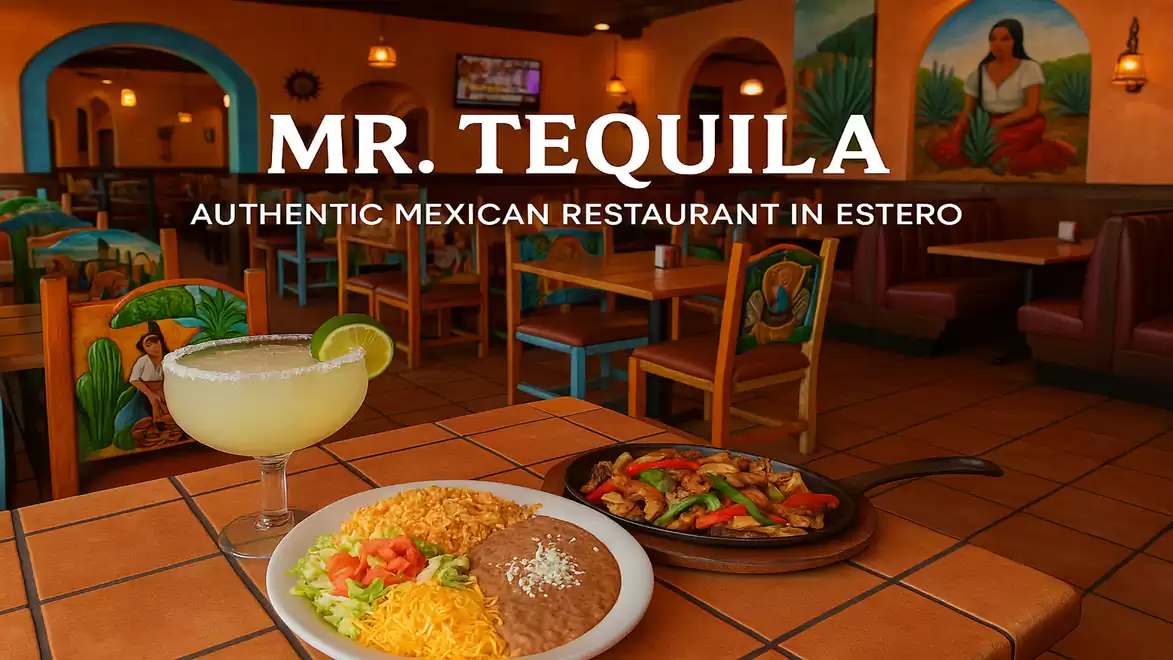 Interior view of an authentic Mexican restaurant featuring a table with traditional dishes, including a margarita and a plate with rice, beans, and fajitas.