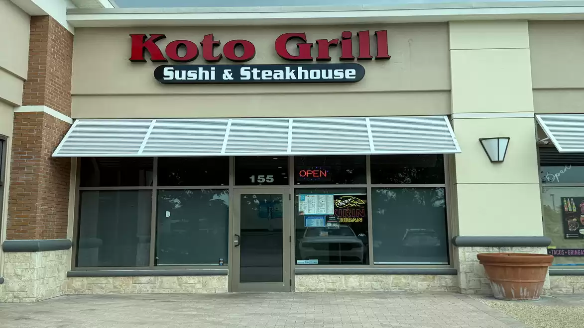 Exterior view of Koto Grill Sushi & Steakhouse featuring a modern facade with clean lines.