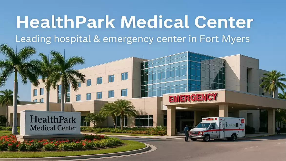 Exterior view of HealthPark Medical Center in Fort Myers with emergency entrance and ambulance.