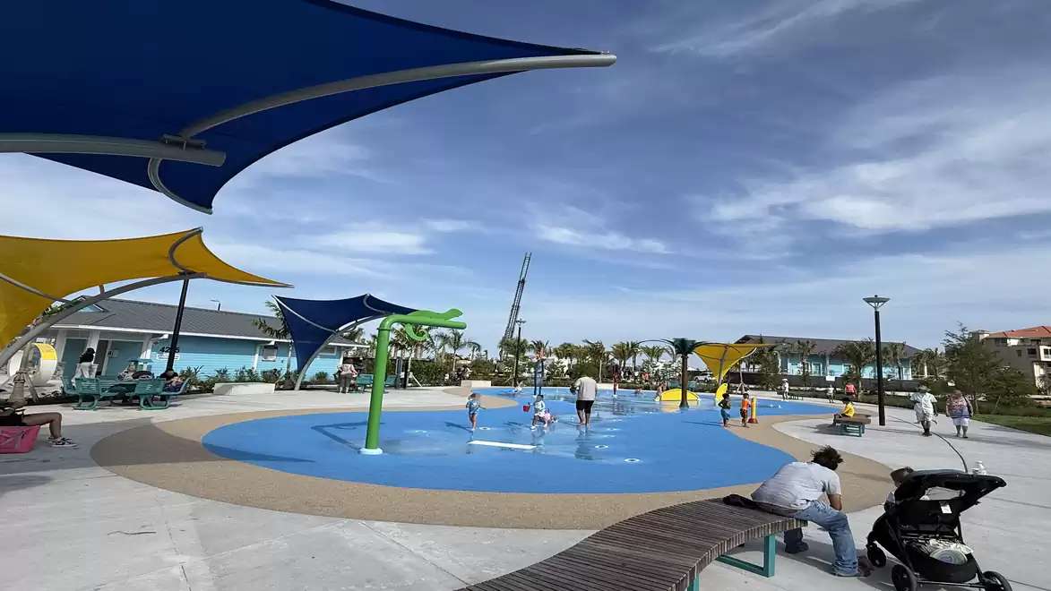 Jaycee Park in Cape Coral with a splash pad where children are playing under sunshades.