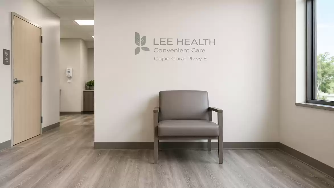 Modern waiting room with a single gray chair and large windows at Lee Health Convenience Care.