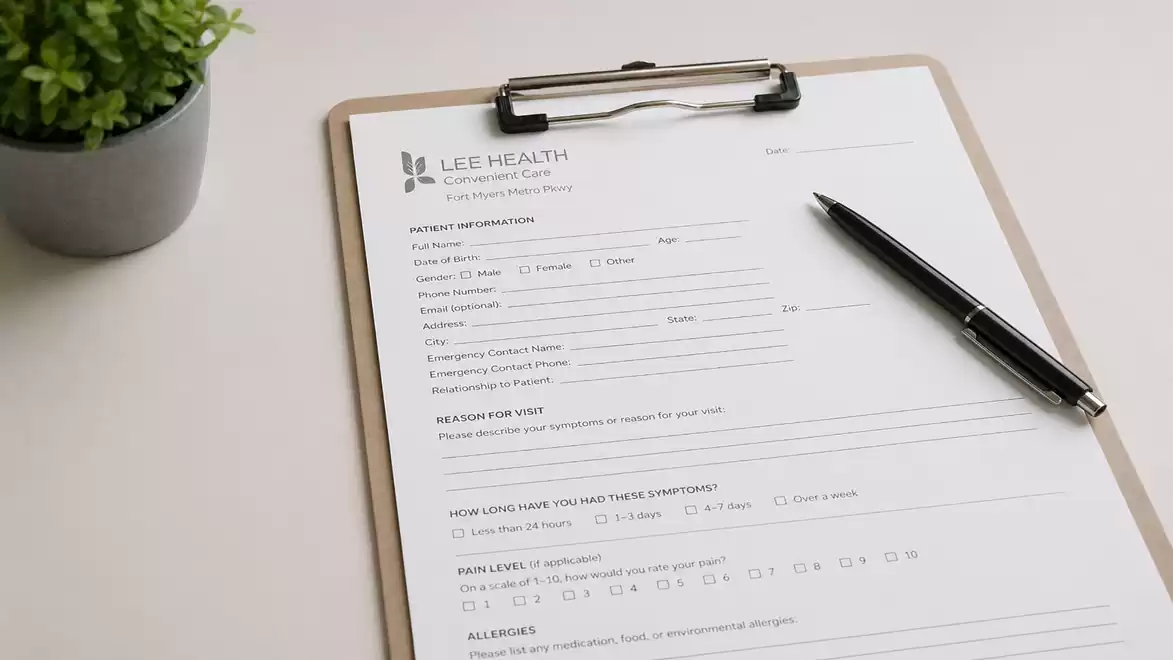 A clipboard with a medical form and a pen on it, next to a small plant.