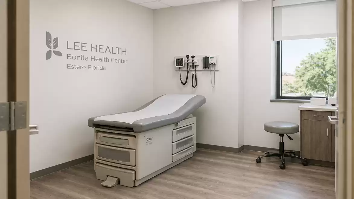 Interior view of a modern examination room with an exam table and medical equipment on the wall at Lee Health Bonita Health Center.