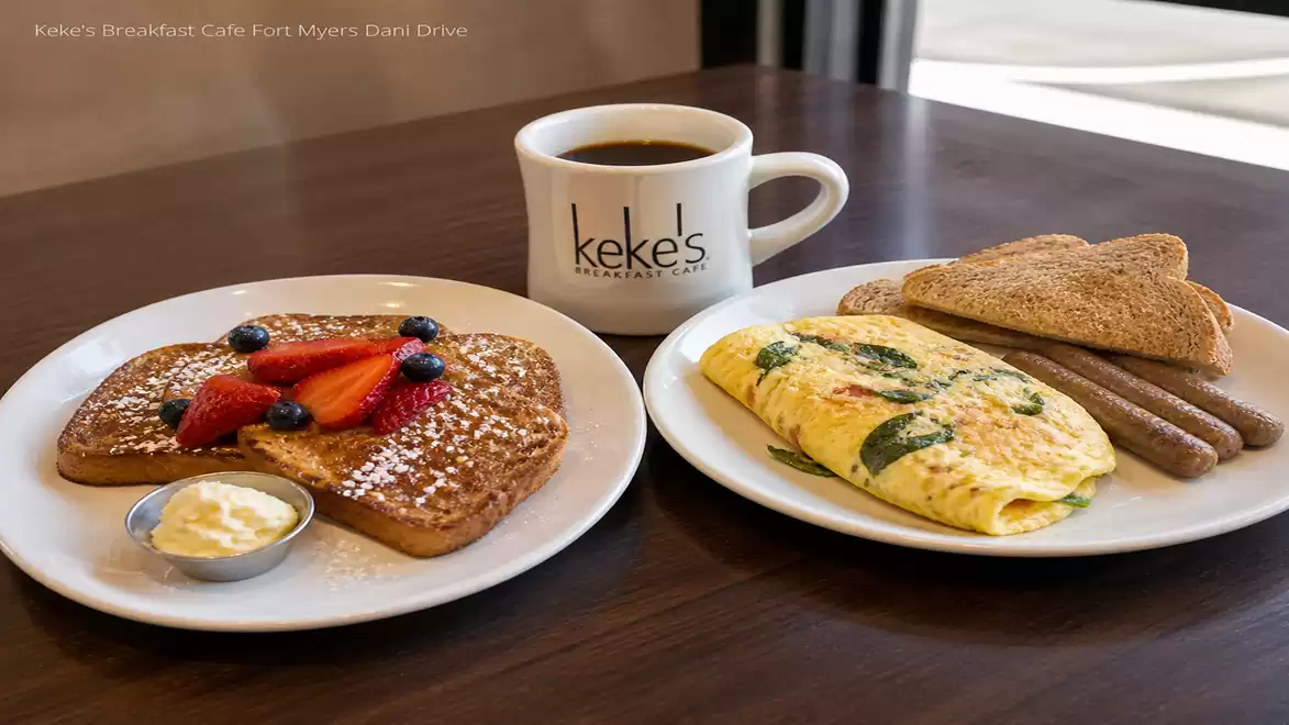 Breakfast table with French toast, omelette, toast, coffee, and sausage at Keke's Breakfast Cafe.