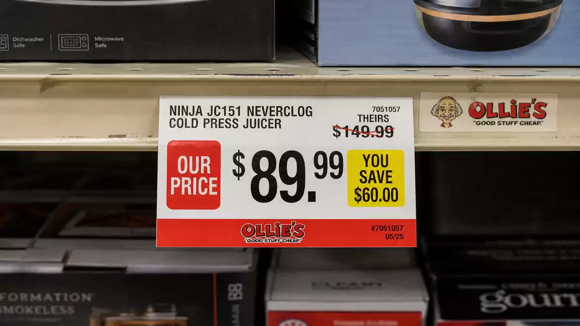 Shelf with a price tag for a juicer at Ollie's, showing a reduced price of $89.99, saving $60.00.
