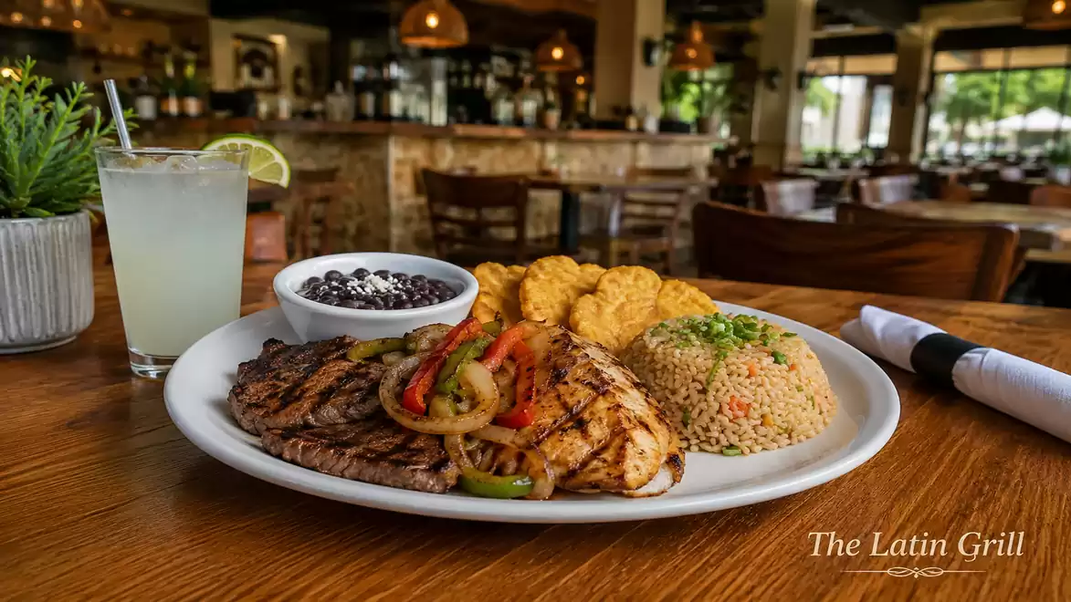 A plate with grilled meat, rice, beans, and plantains in an elegant restaurant, with a drink on the table.