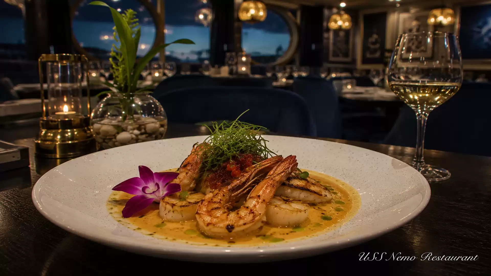 Gourmet dish with shrimp and sauce, decorated with a flower in an elegant restaurant.