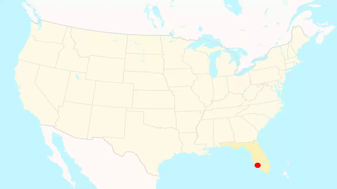 Map of the USA highlighting the state of Florida in yellow with a red dot marking a specific location.