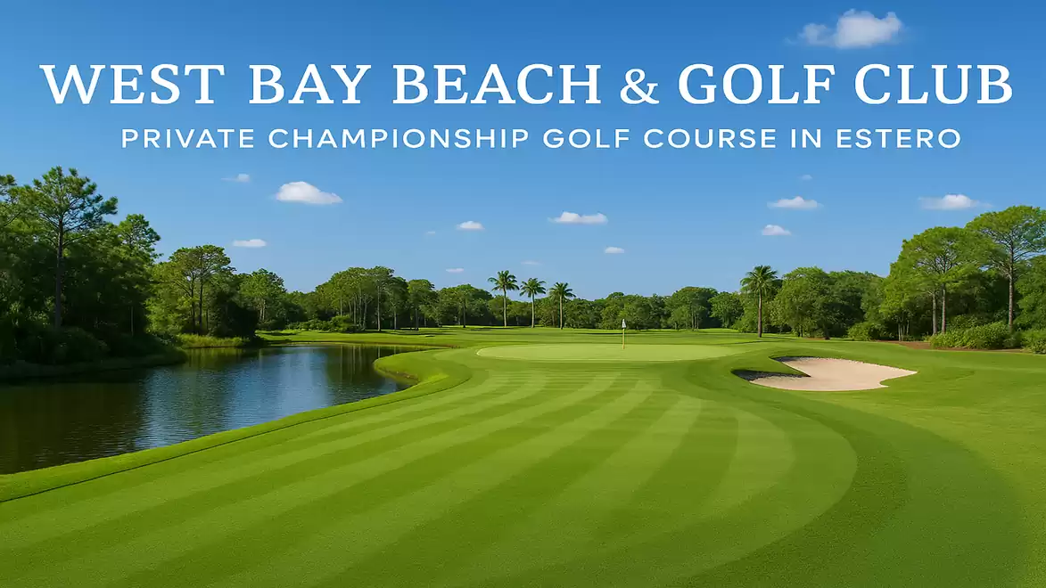 Green golf course with water hazard and bunker at West Bay Beach & Golf Club under blue sky.