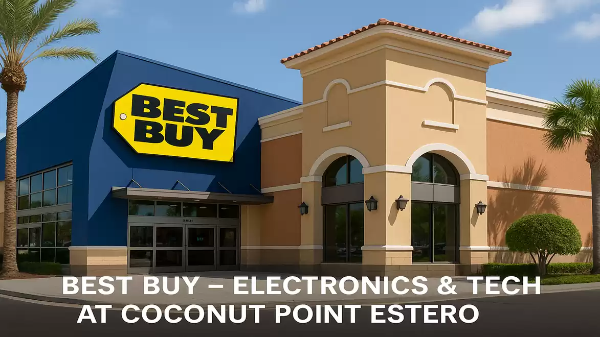 Best Buy store at Coconut Point Estero with blue facade and yellow logo, surrounded by palm trees.