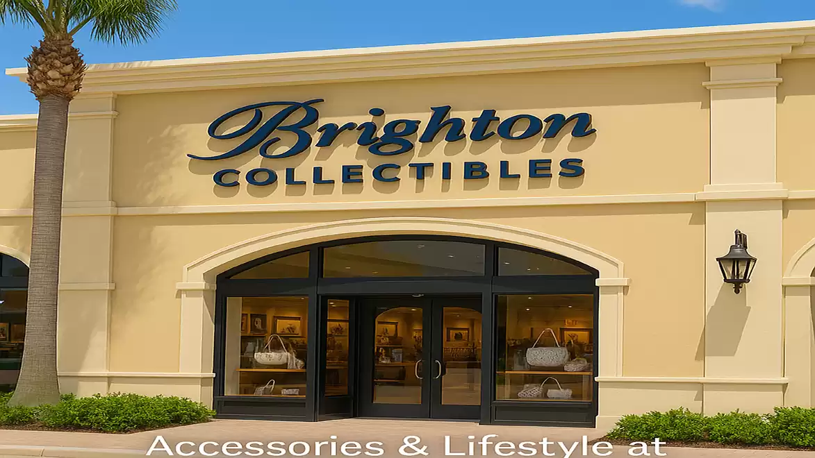 Exterior view of a Brighton Collectibles store with an elegant facade and well-lit storefront in a shopping center.