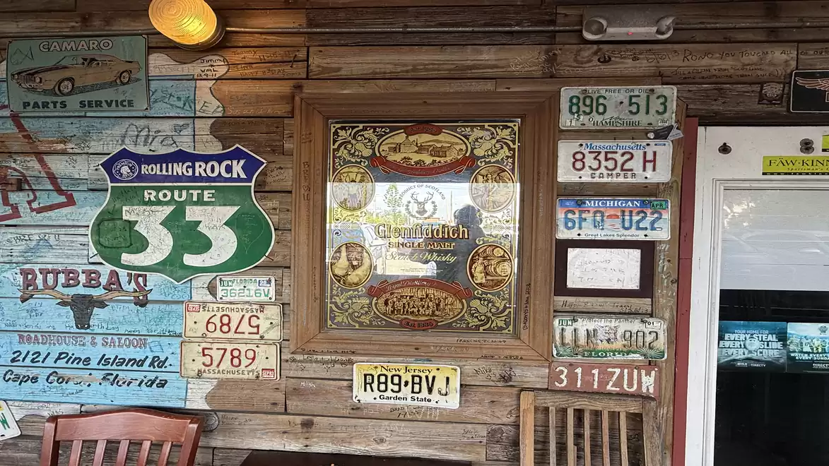 Rustic wall decoration with street signs and retro signs in a cozy tavern.