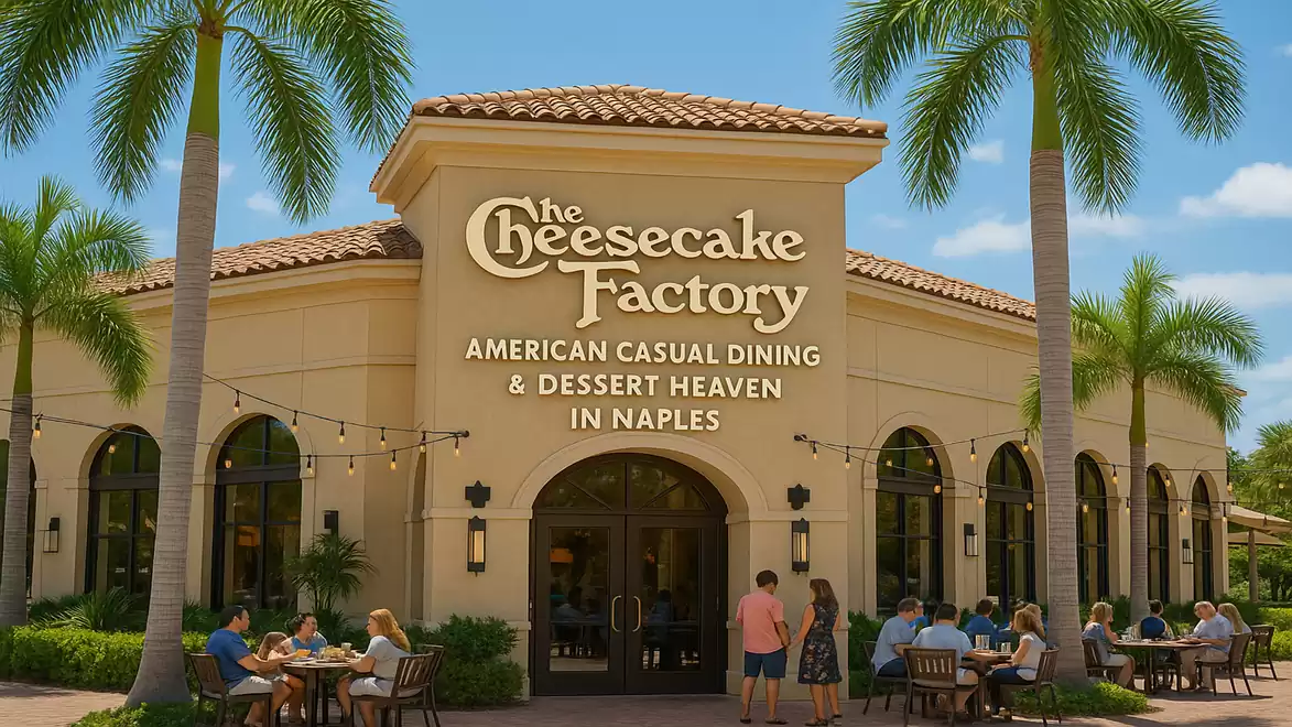 Exterior view of The Cheesecake Factory restaurant in Naples with palm trees and guests dining outside.